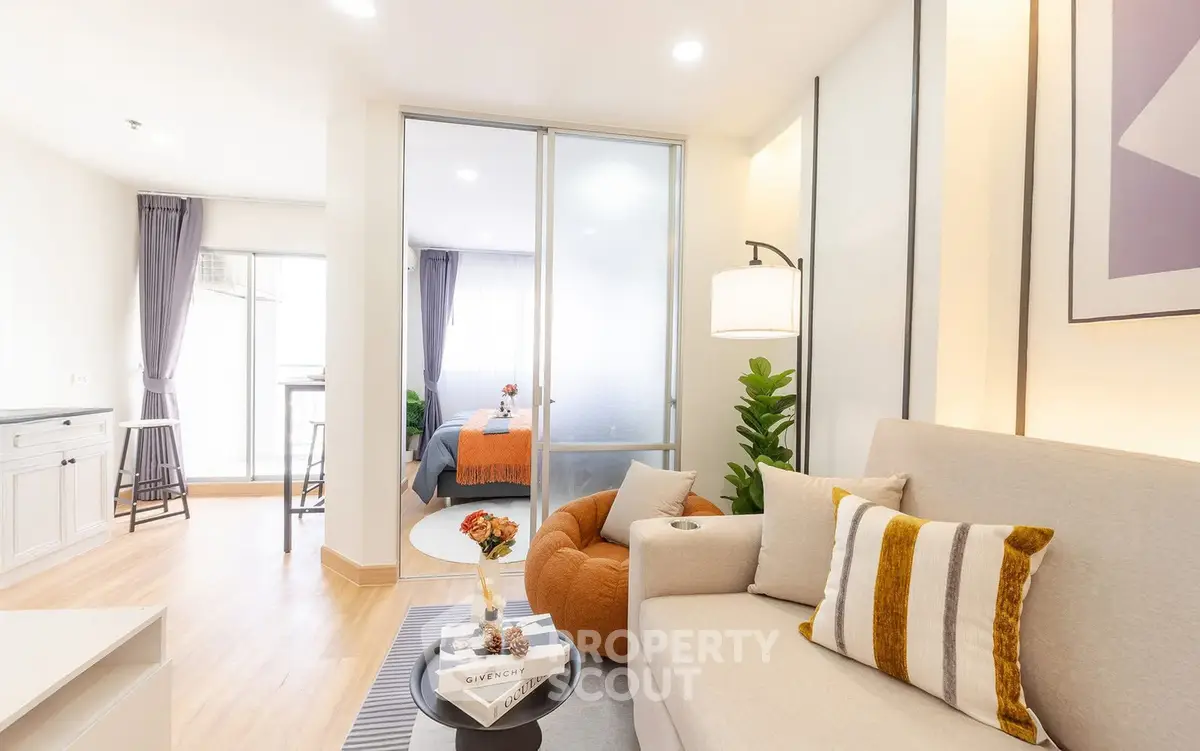 Modern living room with cozy decor and natural light in a stylish apartment