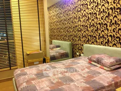 Stylish bedroom with patterned wallpaper and cozy bed in modern apartment