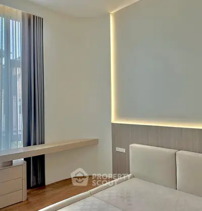 Modern bedroom with elegant lighting and stylish decor