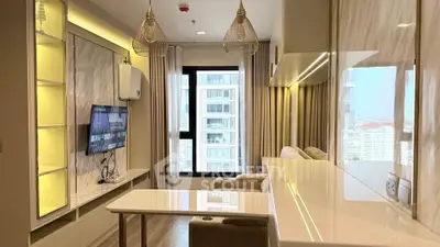 Modern living room with elegant lighting and city view, featuring a sleek TV setup and stylish decor.