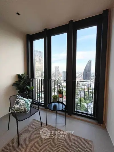 Stylish balcony with city view, modern furniture, and lush greenery for urban living.