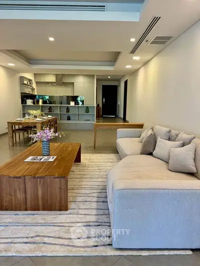 Spacious modern living room with open kitchen and elegant decor