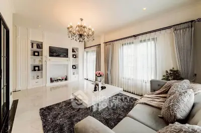 Luxurious living room with elegant chandelier and plush furnishings