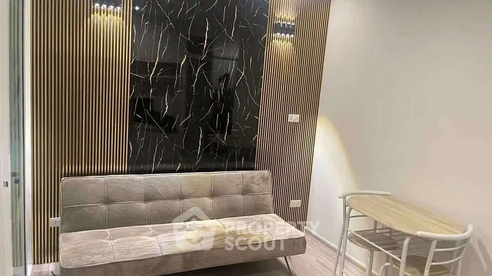 Modern living room with stylish sofa and elegant wall design
