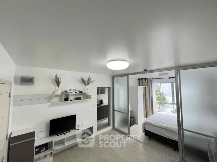 Modern studio apartment with sleek design and natural light