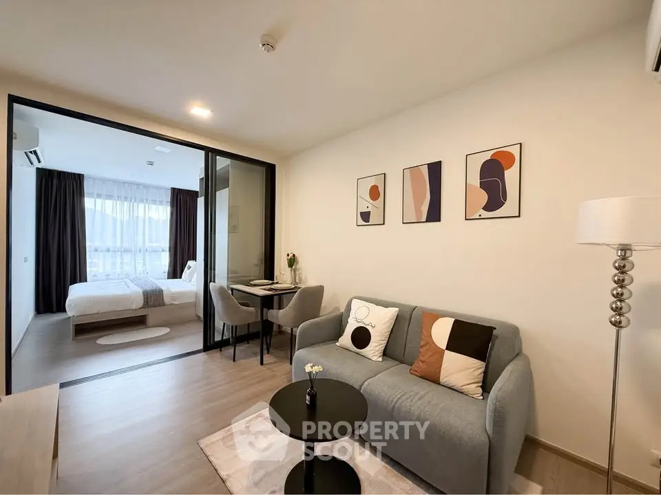 Modern open-plan living room with stylish decor and cozy seating area