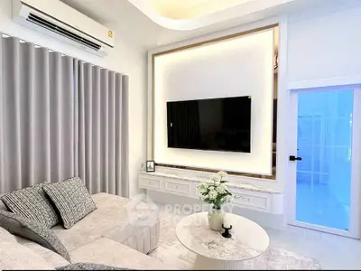 Luxurious modern living room with elegant decor and wall-mounted TV