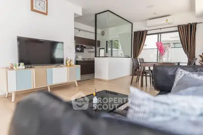 Modern living room with stylish decor and open kitchen layout