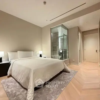 Luxurious bedroom with modern ensuite bathroom and elegant decor