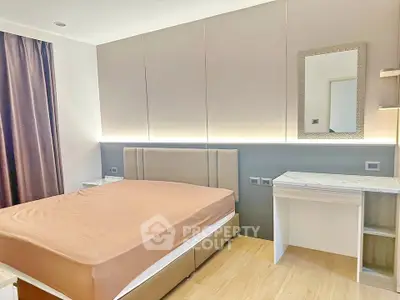 Modern bedroom with elegant design and ambient lighting, featuring a comfortable bed and stylish decor.