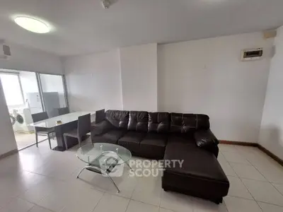 Spacious living room with modern furniture and open kitchen layout