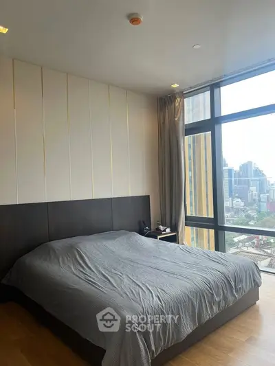 Luxurious bedroom with panoramic city view and modern design