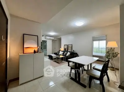 Modern open-plan living room with dining area and stylish decor