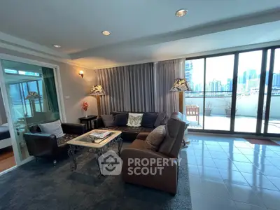 Spacious living room with large windows and city view, featuring modern furniture and elegant decor.