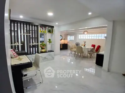 Spacious modern living room with elegant dining area and stylish decor