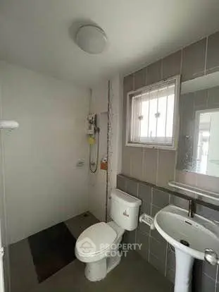 Modern bathroom with sleek fixtures and neutral tiles