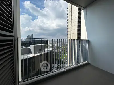 Spacious balcony with city view in modern high-rise building
