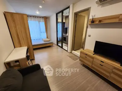 Modern studio apartment with open layout and stylish wooden furniture