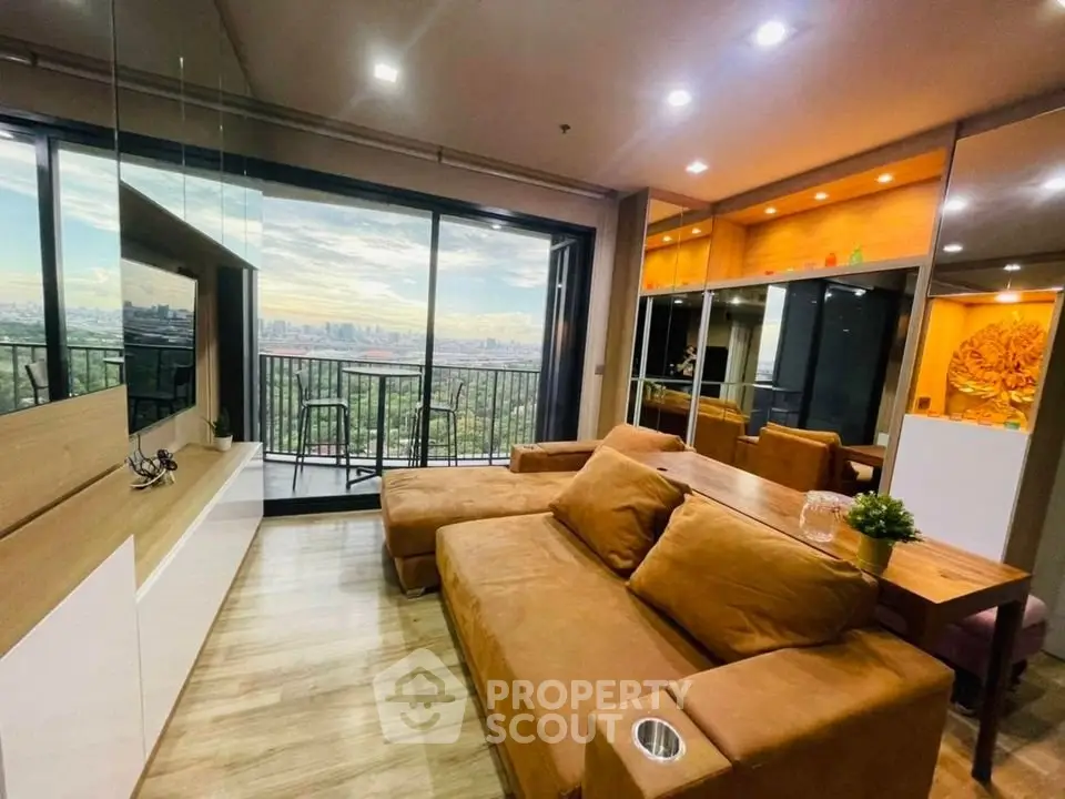 Modern living room with stunning city view and cozy brown sofa