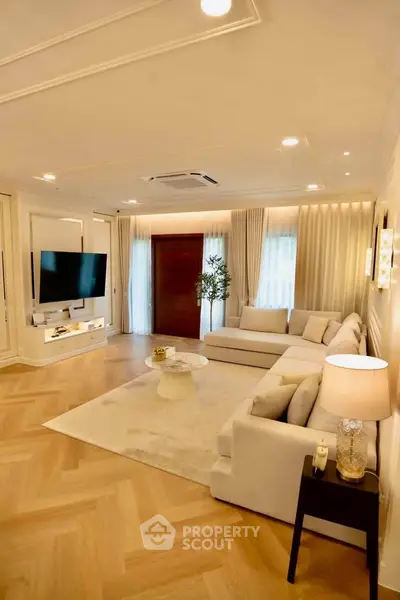 Luxurious living room with elegant decor, spacious layout, and modern furnishings in a high-end property.