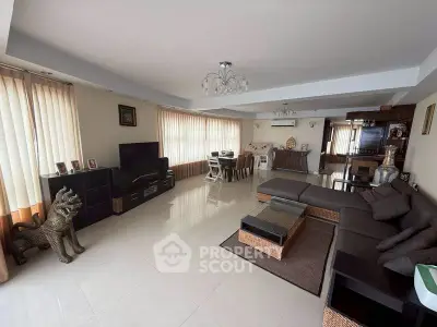 Spacious modern living room with elegant decor and ample natural light.