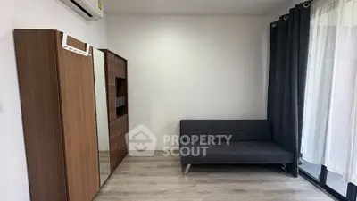 Modern minimalist living room with sleek furniture and large window