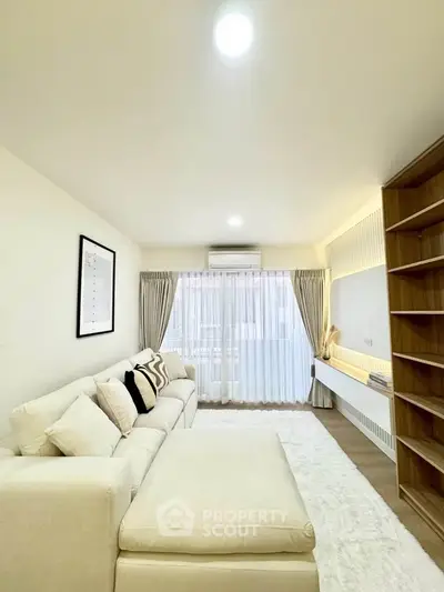 Spacious modern living room with cozy white sofa and elegant decor