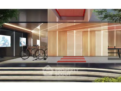 Modern building entrance with sleek design and bicycle parking area.