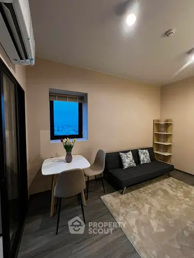 Cozy living room with modern decor and city view window