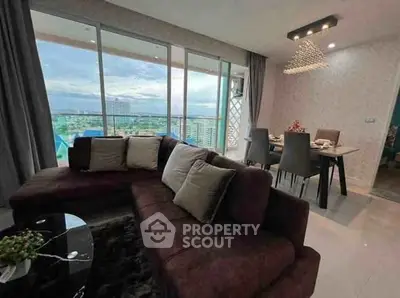 Luxurious living room with panoramic city view and elegant dining area