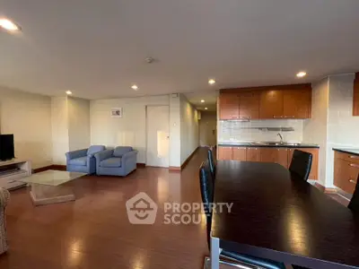 Spacious open-plan living room with modern kitchen and dining area