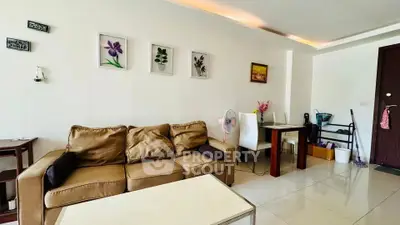 Cozy living room with modern decor and comfortable seating in a stylish apartment.
