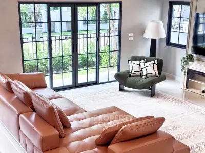 Spacious modern living room with large windows and stylish furniture