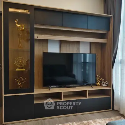 Modern living room with stylish TV unit and decorative shelves