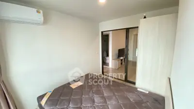Cozy bedroom with air conditioning and sliding door to living area