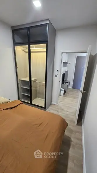 Modern bedroom with walk-in closet and stylish decor