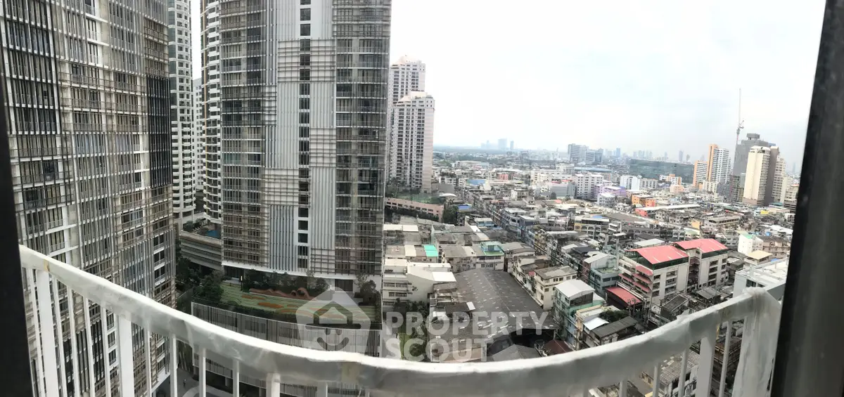 Stunning cityscape view from a high-rise balcony, showcasing urban living at its finest.