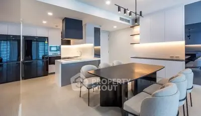 Modern kitchen and dining area with sleek design and open layout