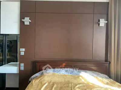 Elegant bedroom with modern lighting and luxurious bedding