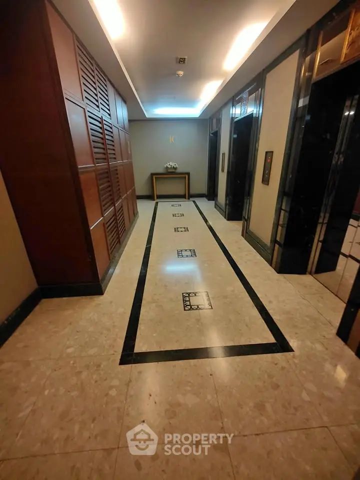 Elegant elevator lobby with marble flooring and modern design