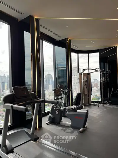 Luxurious high-rise gym with panoramic city views and modern fitness equipment.