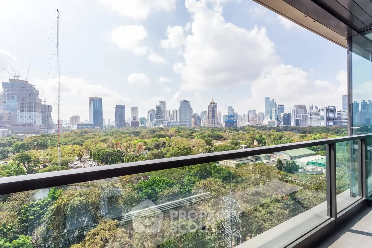Stunning cityscape view from a modern balcony overlooking lush greenery and skyline.