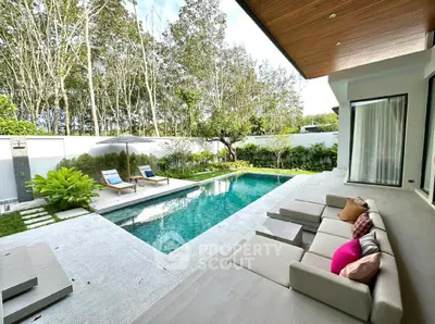 Luxurious modern villa with private pool and lush garden view