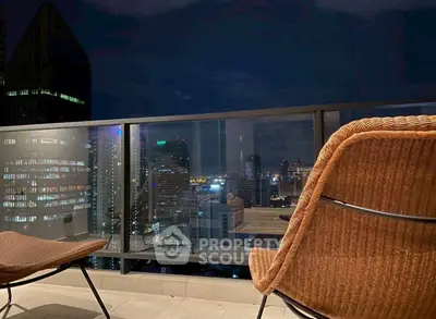 Stunning cityscape view from a modern balcony at night, perfect for urban living enthusiasts.