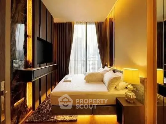 Luxurious bedroom with modern decor and city view, featuring ambient lighting and elegant furnishings.