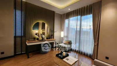Elegant living room with modern decor, large window, and stylish furniture, perfect for relaxation and entertaining.