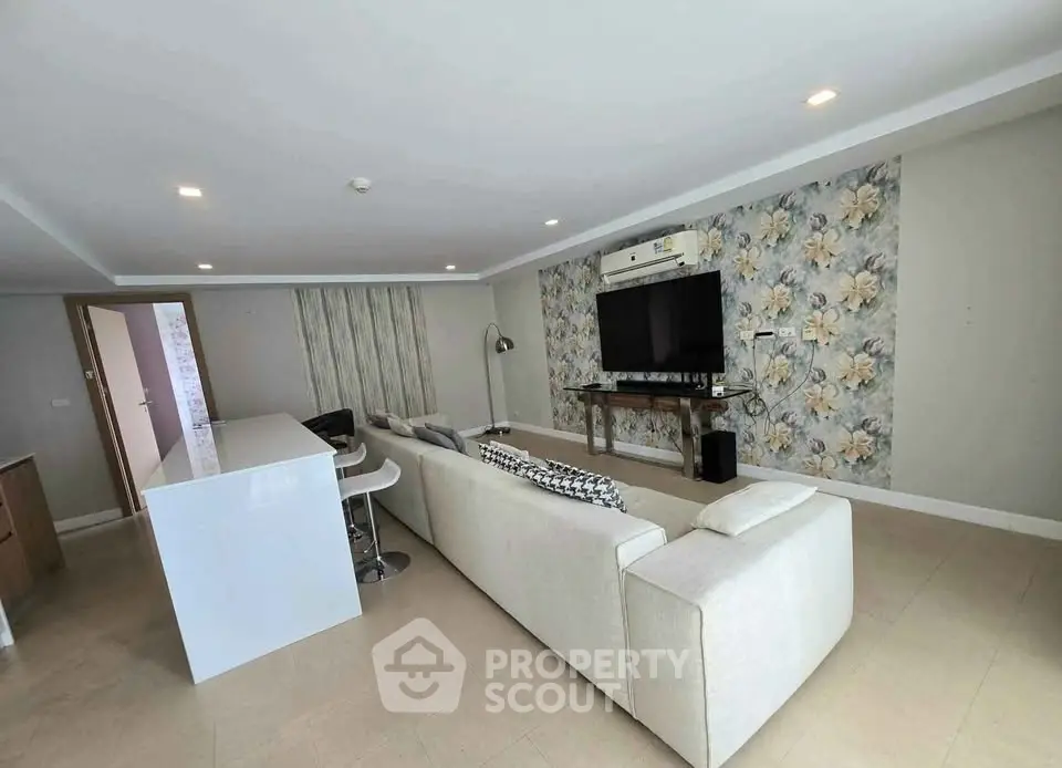 Spacious modern living room with stylish decor and open layout, perfect for relaxation and entertainment.