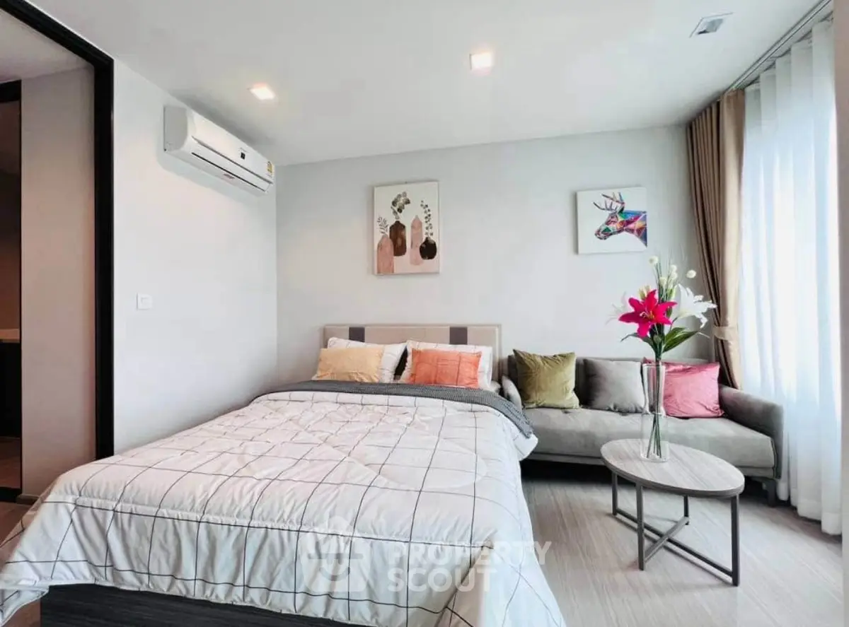 Modern bedroom with cozy bed and stylish decor in bright apartment