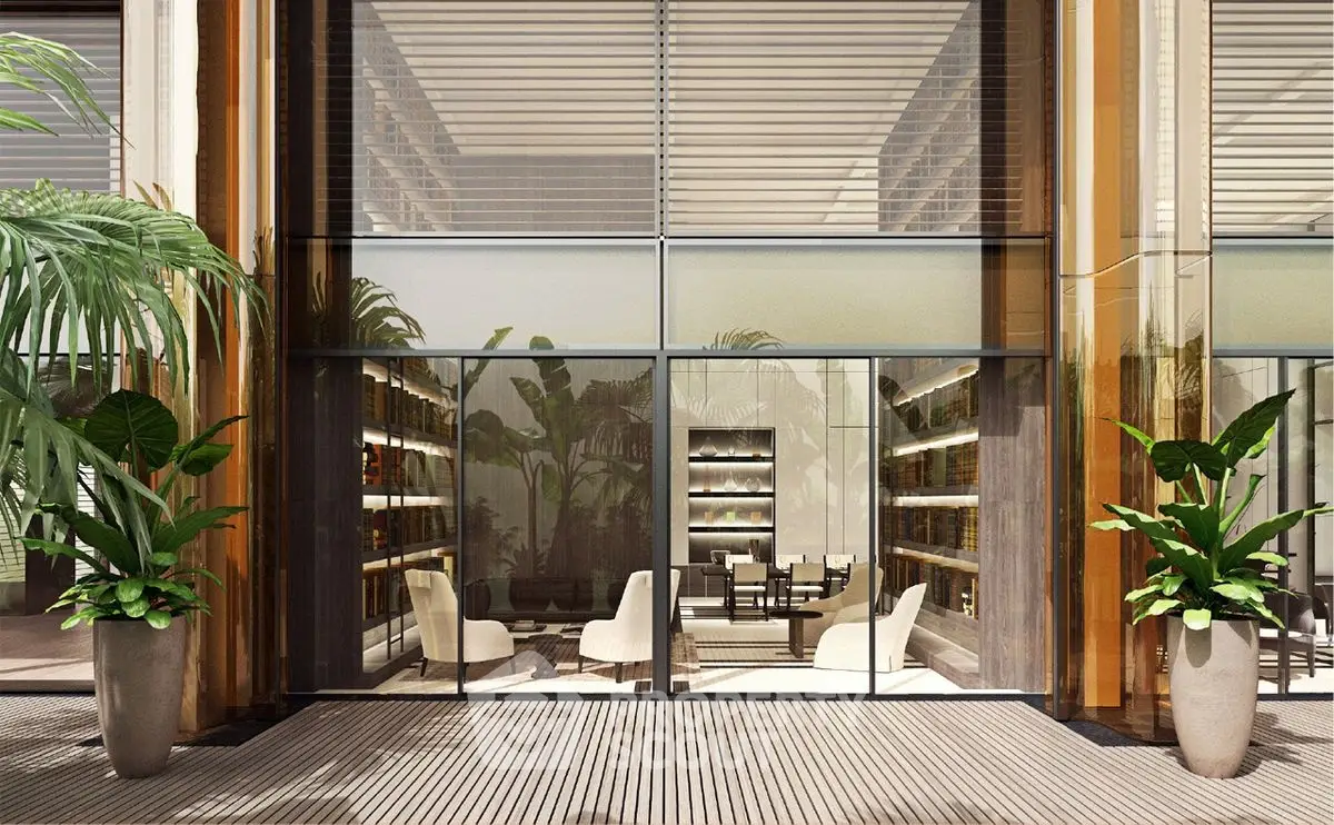 Luxurious modern building entrance with elegant glass facade and lush greenery