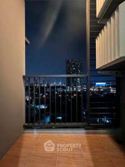 Stunning night view from a modern balcony overlooking city skyline.